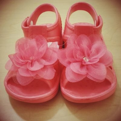 close-up-pink-baby-sandals-floor-home_1048944-1791633